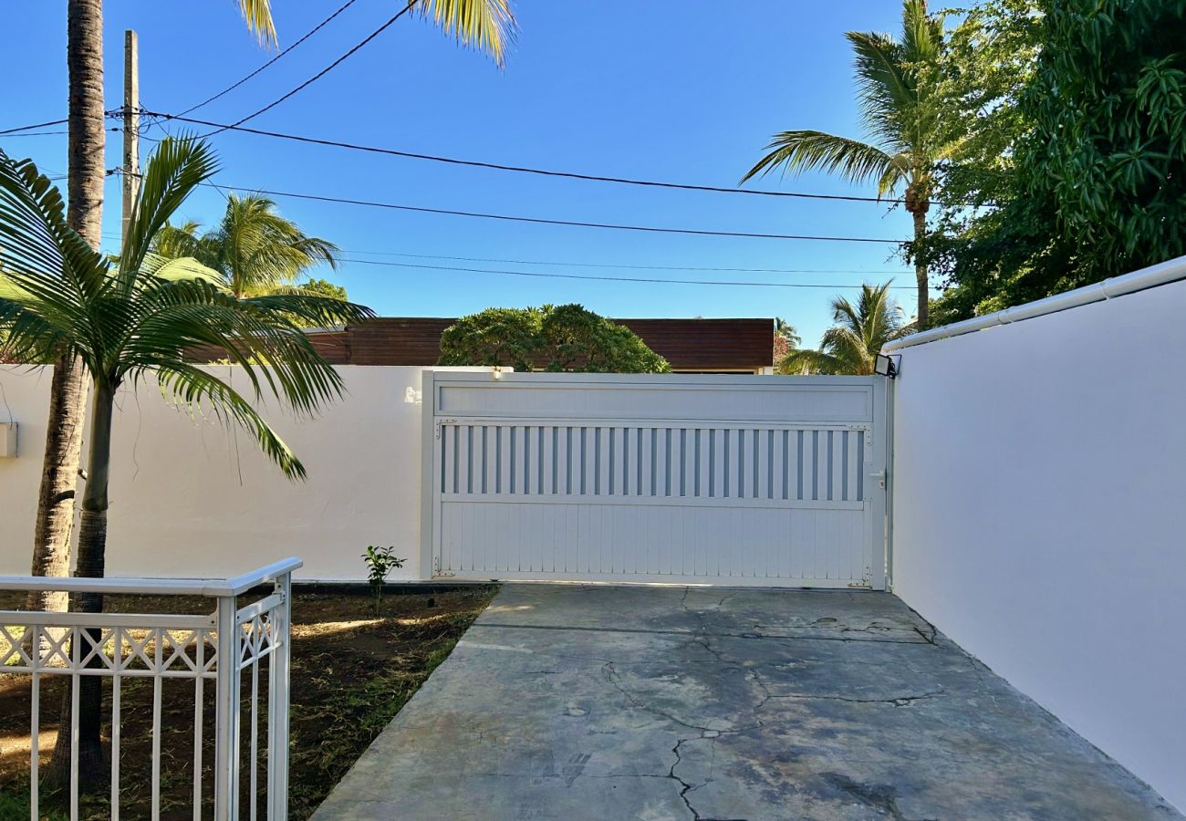 Driveway leading to the garage and gate