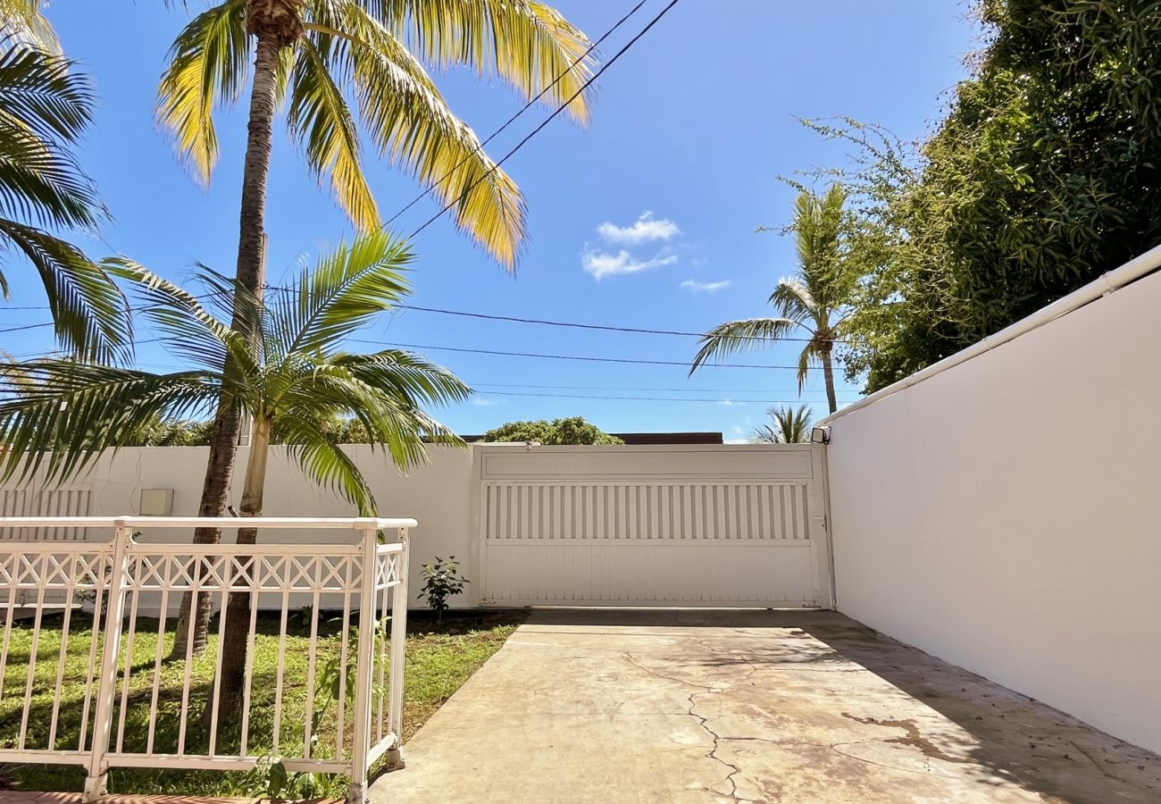 Driveway leading to the garage and gate